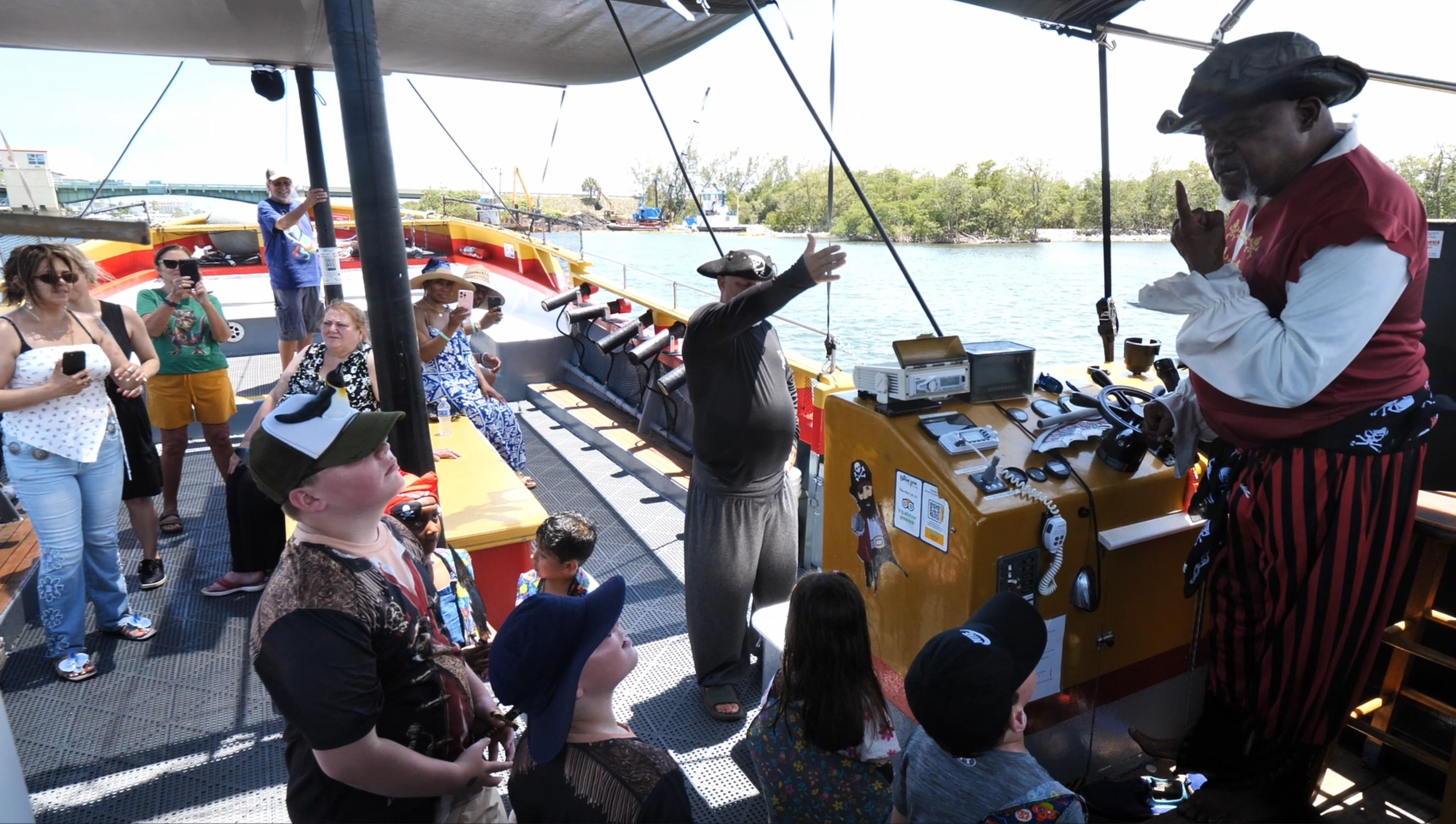 Captain Black Sparrow leading pirate boat tour with crew
